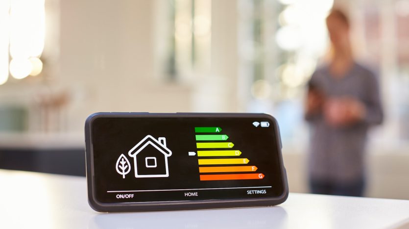 Smart Energy Meter In Kitchen Measuring Energy Efficiency With Figure In Background